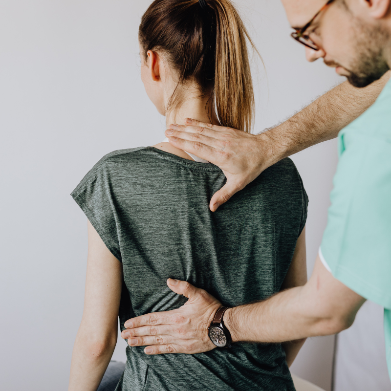 osteopath helping patient 